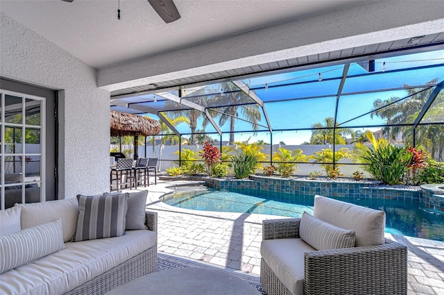 view of pool with a fenced in pool, a patio, a ceiling fan, and outdoor lounge area