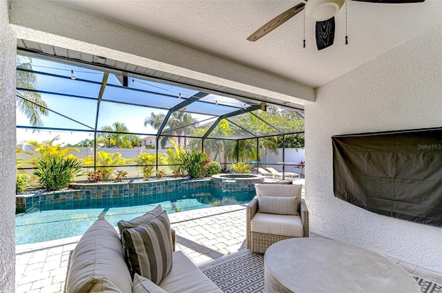 view of pool with a patio, a lanai, a ceiling fan, and a pool with connected hot tub