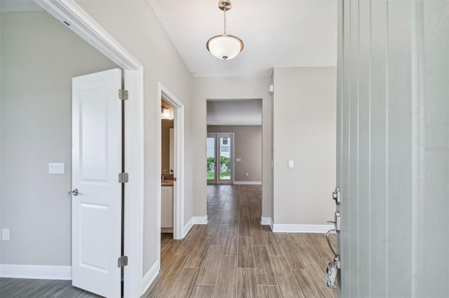 entrance foyer with light wood-style floors and baseboards