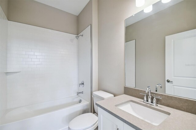 full bathroom featuring vanity, toilet, and washtub / shower combination