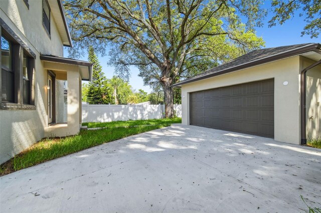 garage featuring fence