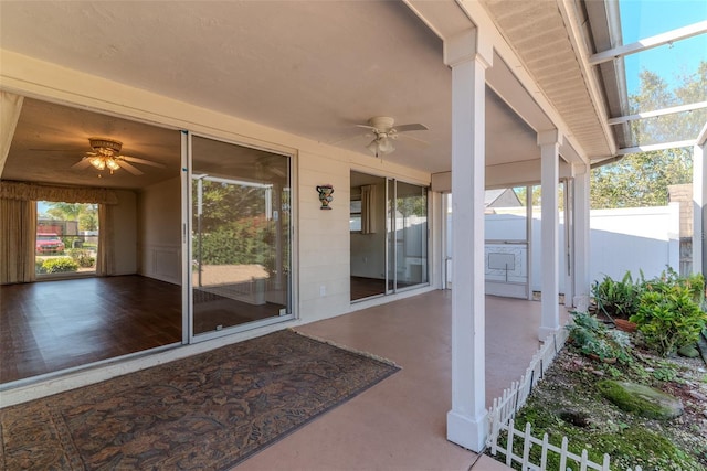 view of patio / terrace with fence and ceiling fan