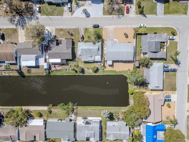 aerial view featuring a residential view and a water view