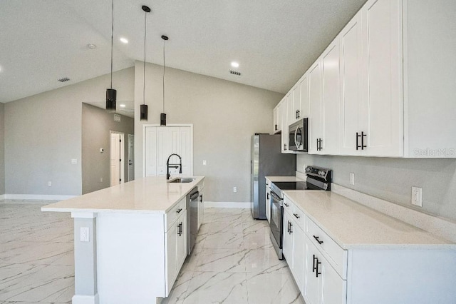 kitchen with marble finish floor, a center island with sink, a sink, appliances with stainless steel finishes, and white cabinets