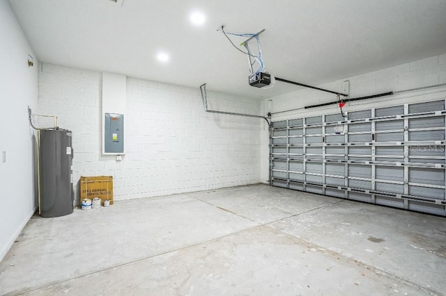 garage featuring electric panel, concrete block wall, electric water heater, and a garage door opener