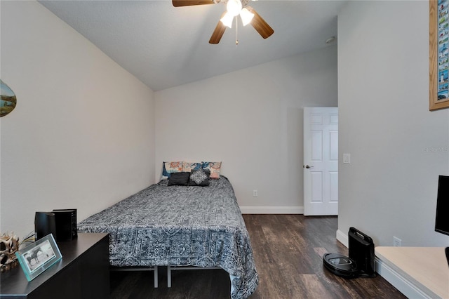 bedroom with ceiling fan, baseboards, wood finished floors, and vaulted ceiling