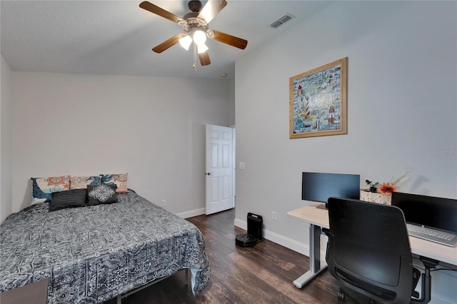 bedroom featuring a ceiling fan, wood finished floors, visible vents, and baseboards