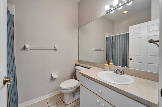 bathroom with vanity, a shower with curtain, baseboards, tile patterned flooring, and toilet