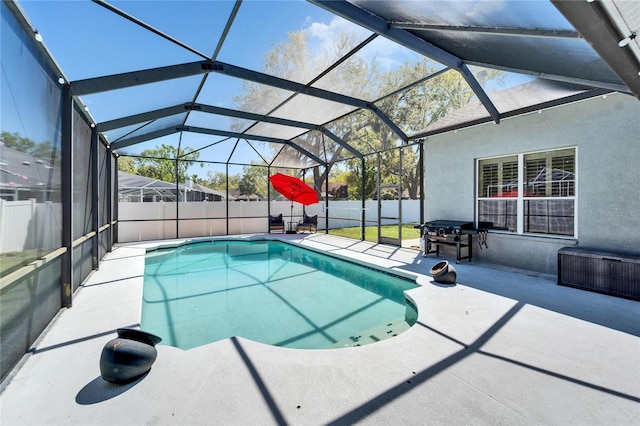 view of pool with area for grilling, a fenced backyard, glass enclosure, a fenced in pool, and a patio area