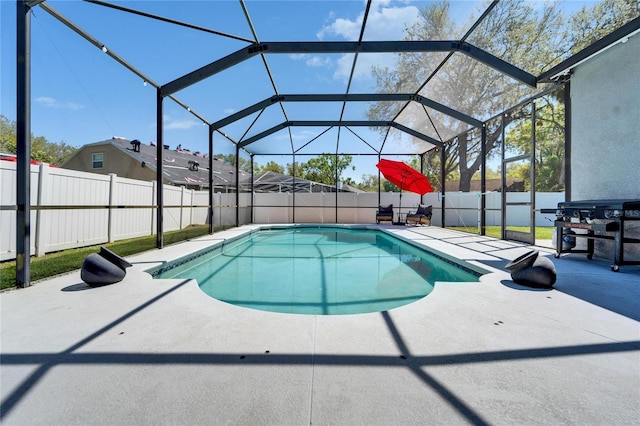 view of pool with grilling area, a fenced in pool, glass enclosure, a fenced backyard, and a patio