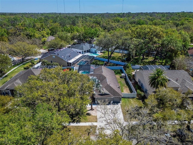 aerial view featuring a view of trees and a residential view