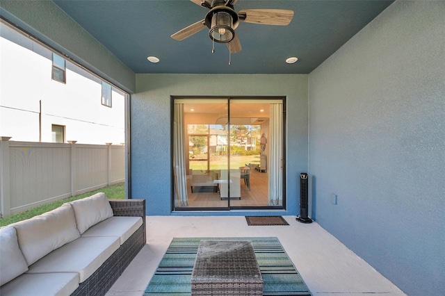 sunroom / solarium with a ceiling fan