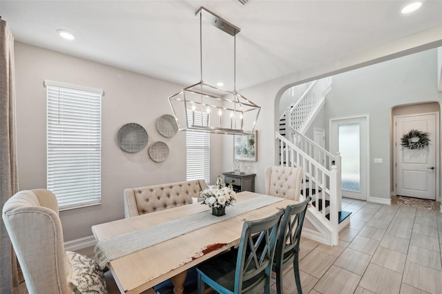 dining area with a notable chandelier, stairway, recessed lighting, and baseboards