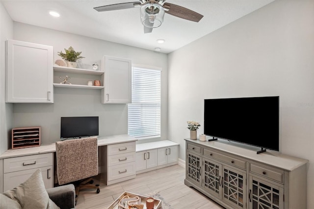 office space featuring recessed lighting, baseboards, light wood-style floors, and ceiling fan