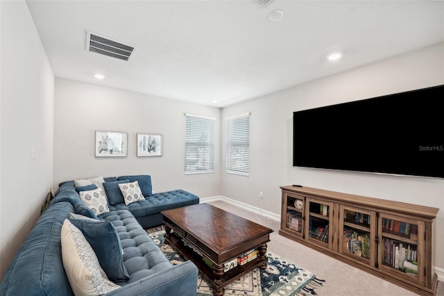 carpeted living room featuring recessed lighting, visible vents, and baseboards