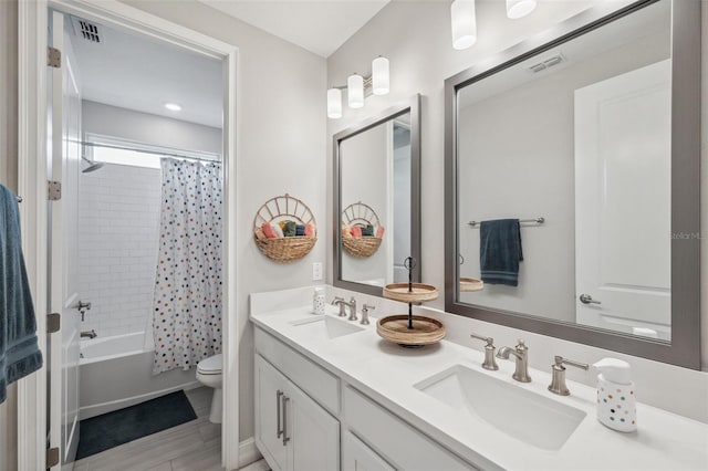 full bathroom featuring a sink, visible vents, and toilet