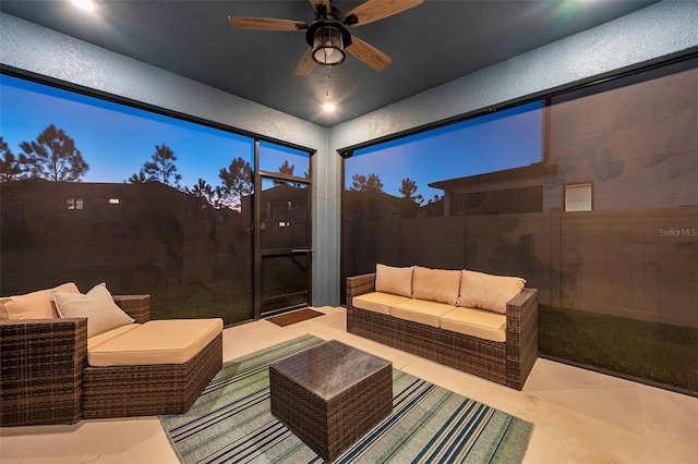 view of patio / terrace with an outdoor hangout area, ceiling fan, and fence