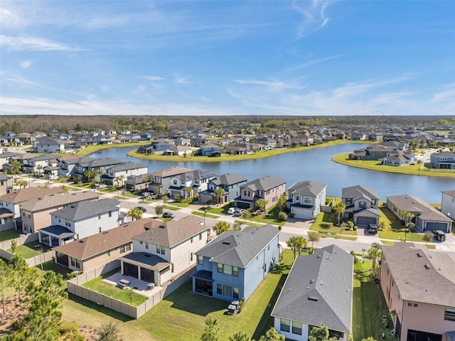 birds eye view of property featuring a residential view and a water view