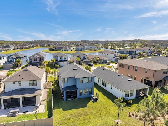 aerial view with a residential view and a water view