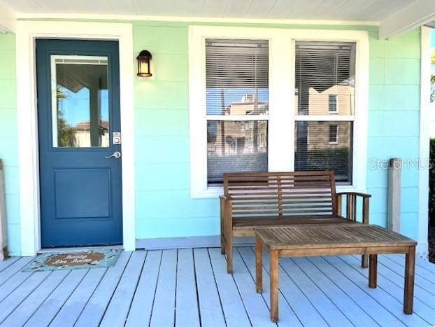 entrance to property featuring a porch