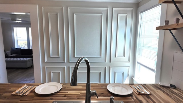 details with wood finished floors and a sink