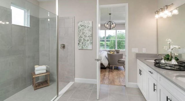 bathroom featuring tile patterned flooring, plenty of natural light, and a walk in shower