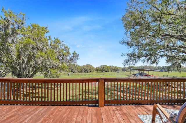 wooden terrace with a lawn