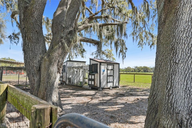 view of shed with fence