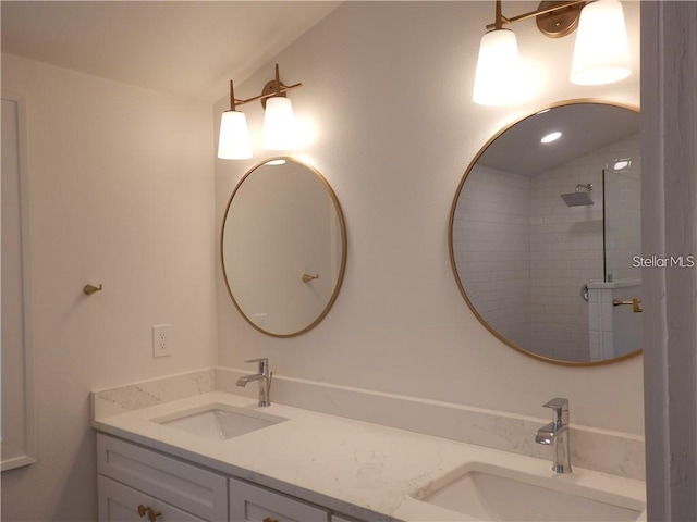 full bathroom with a sink, a tile shower, double vanity, and vaulted ceiling