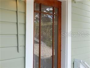 view of exterior entry with concrete block siding