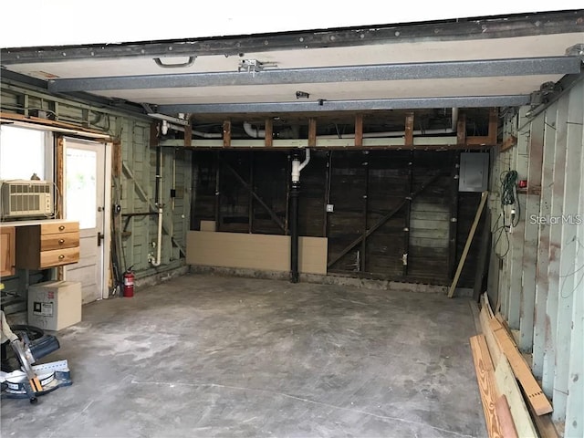 garage with electric panel and cooling unit