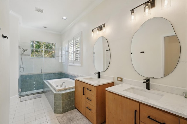 full bath featuring a bath, a shower stall, tile patterned floors, and a sink