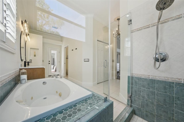 full bathroom featuring vanity, a whirlpool tub, a shower stall, crown molding, and tile patterned floors