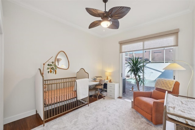 bedroom with crown molding, access to outside, wood finished floors, and baseboards