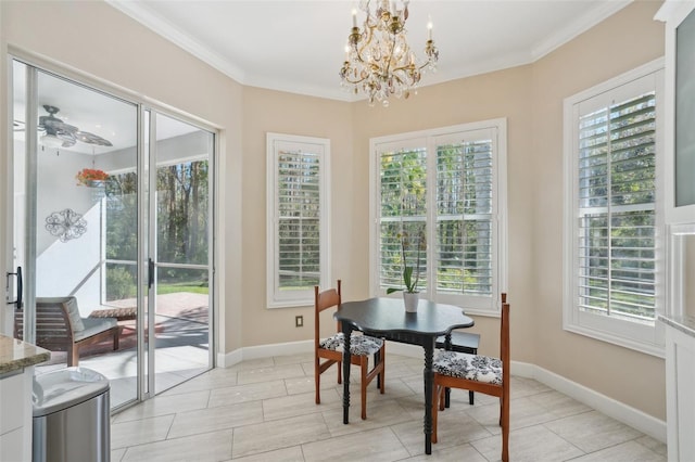 dining area with ceiling fan with notable chandelier, baseboards, and ornamental molding