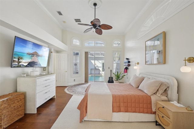 bedroom featuring visible vents, dark wood-type flooring, crown molding, and access to outside