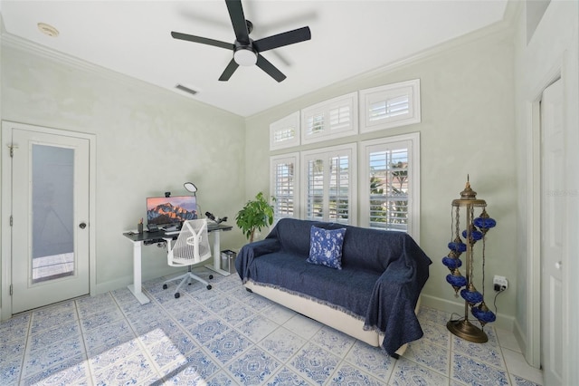 tiled living area featuring visible vents, baseboards, ceiling fan, and crown molding