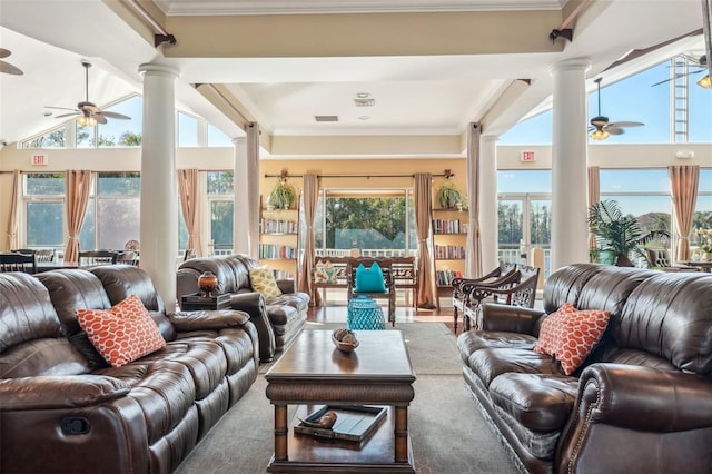 living room featuring visible vents, ceiling fan, ornamental molding, decorative columns, and carpet flooring