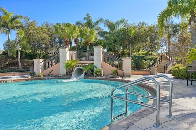 community pool featuring stairs