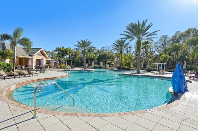 community pool with a patio area