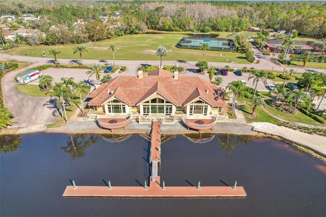 birds eye view of property with a water view