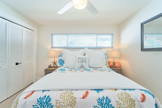 bedroom featuring a closet, ceiling fan, and carpet flooring