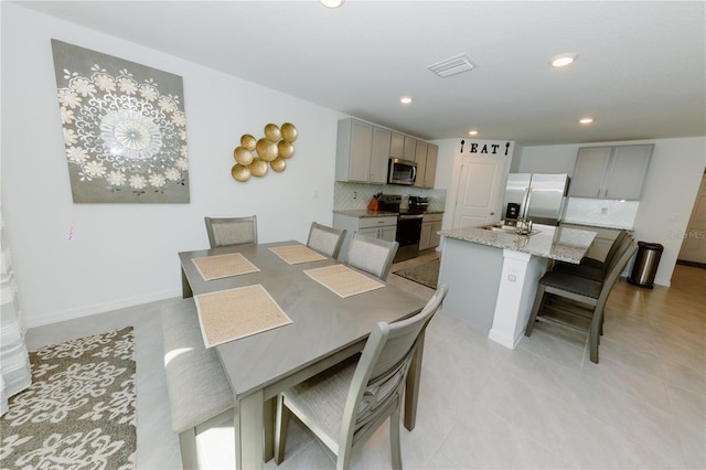 dining room with recessed lighting, visible vents, baseboards, and light tile patterned floors