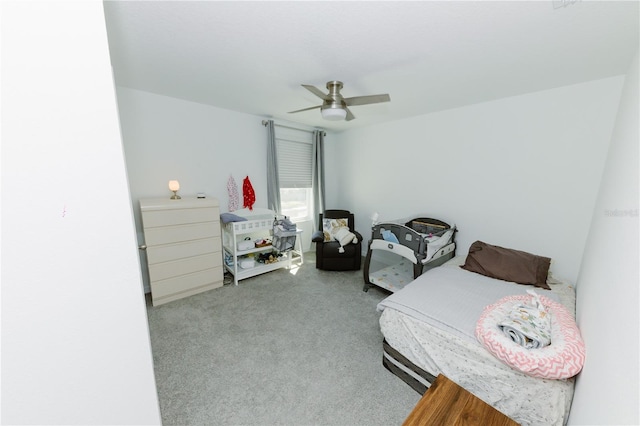 carpeted bedroom with ceiling fan