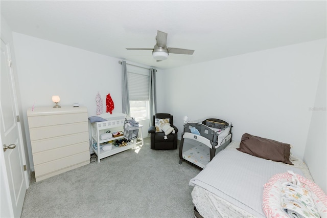 carpeted bedroom featuring a ceiling fan