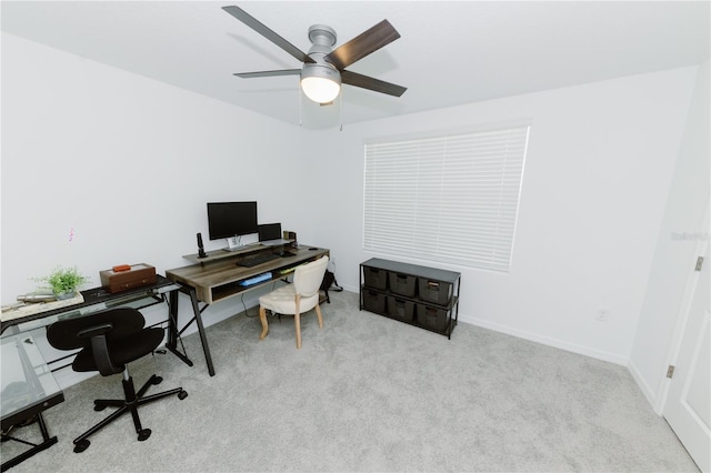 office with a ceiling fan, carpet, and baseboards