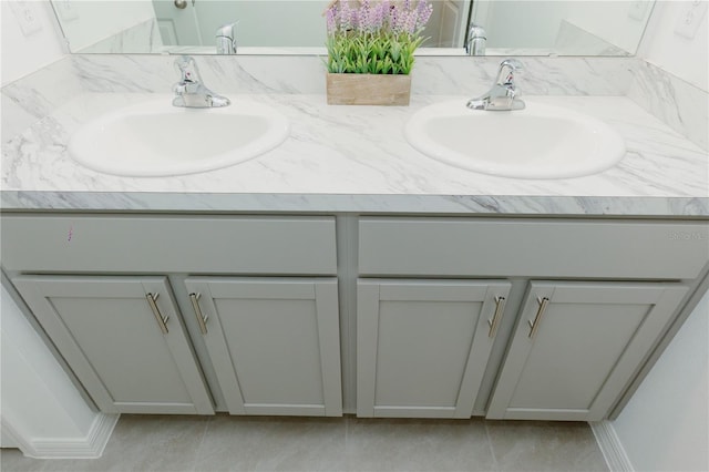 full bath featuring a sink and double vanity