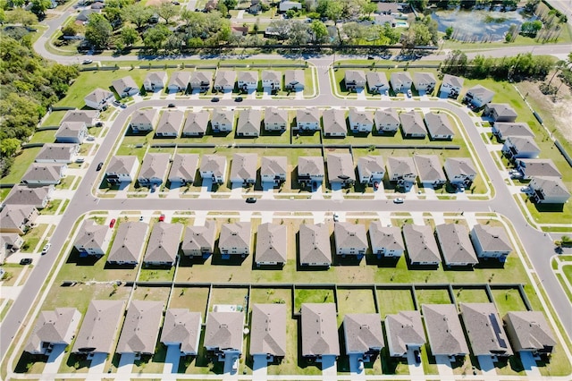 birds eye view of property with a residential view