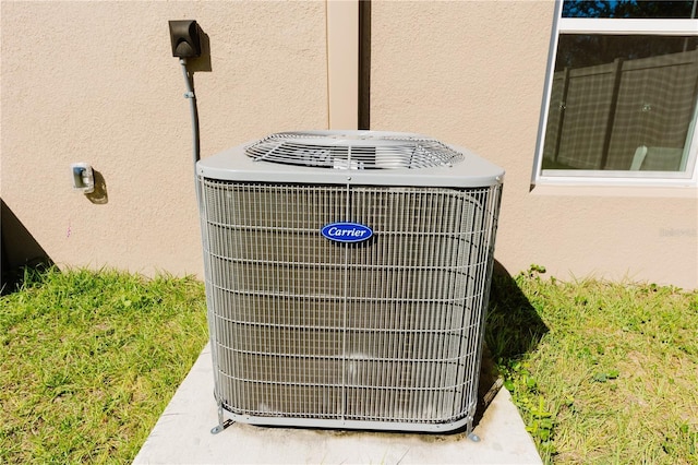 details with central air condition unit and stucco siding