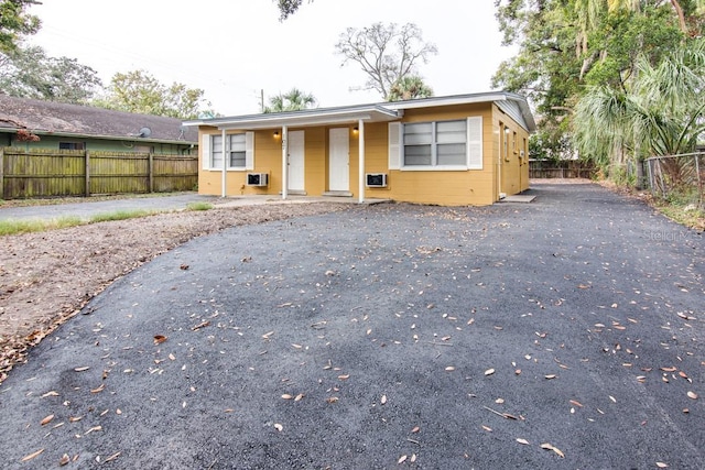 view of front of home featuring fence